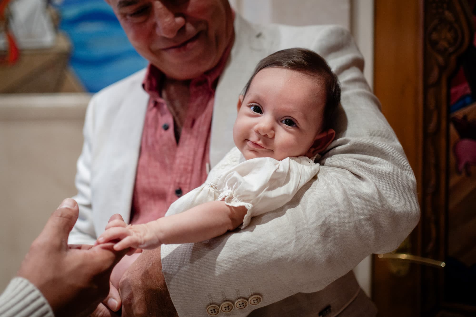 Baptism ceremony at a Sydney church, family gathered around the font